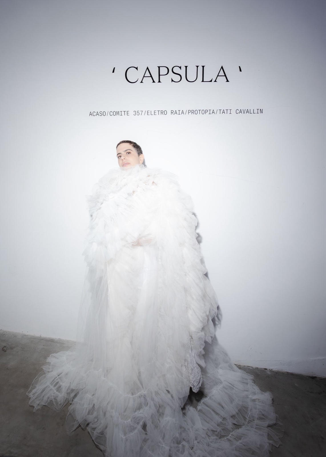 CAPSULA wall text with figure in white tulle