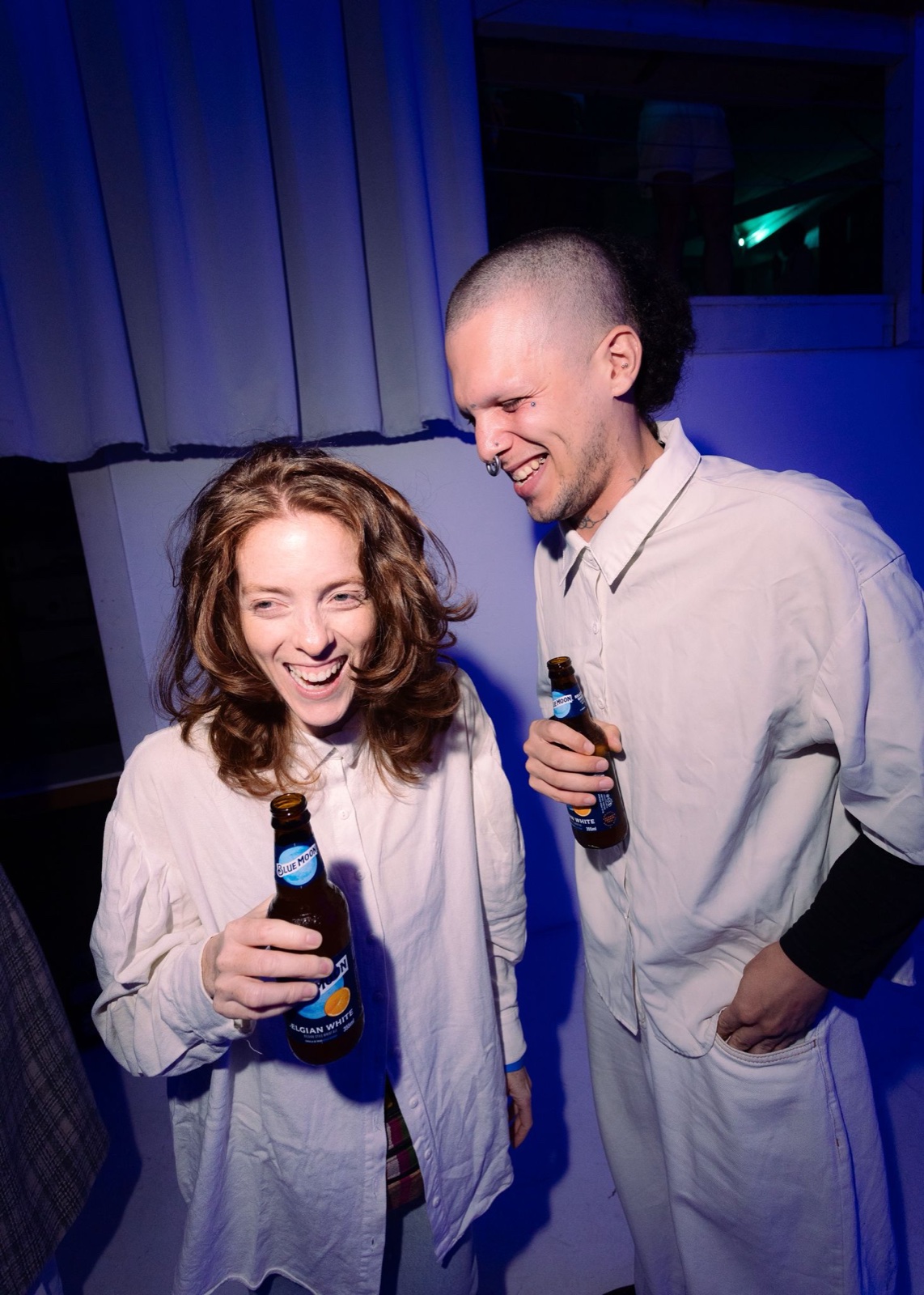 Two guests laughing during the Bluemoon activation