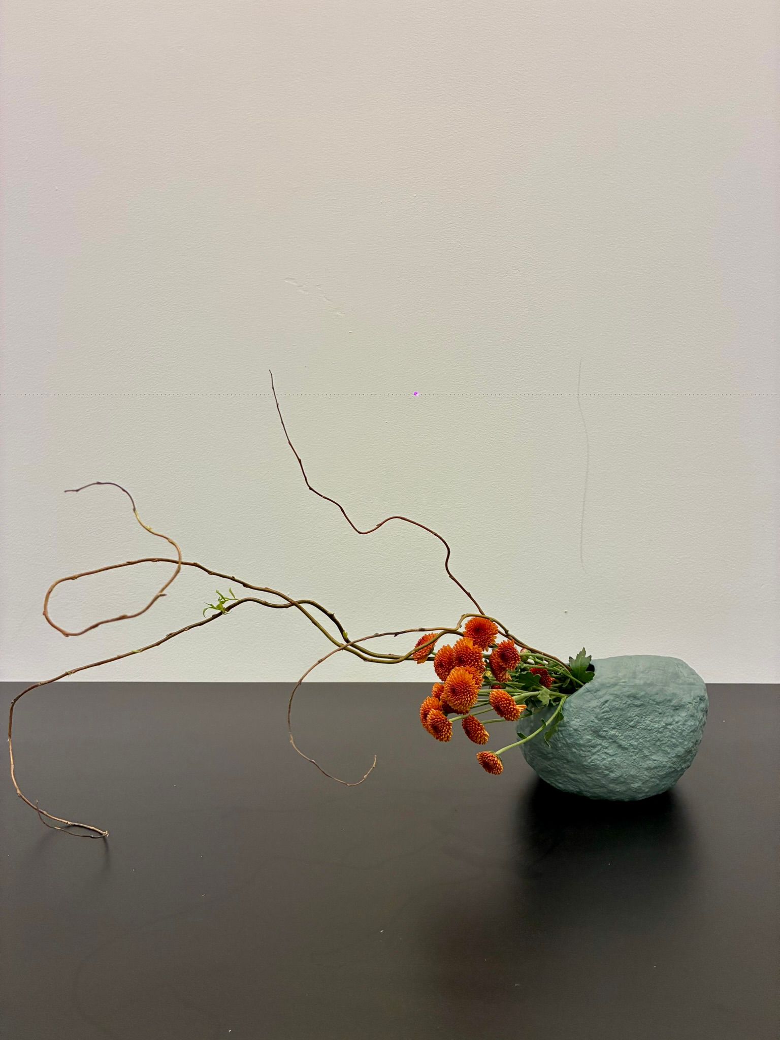 Floral arc on dark table